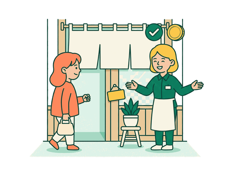 お店の入口でお客様を迎える店主